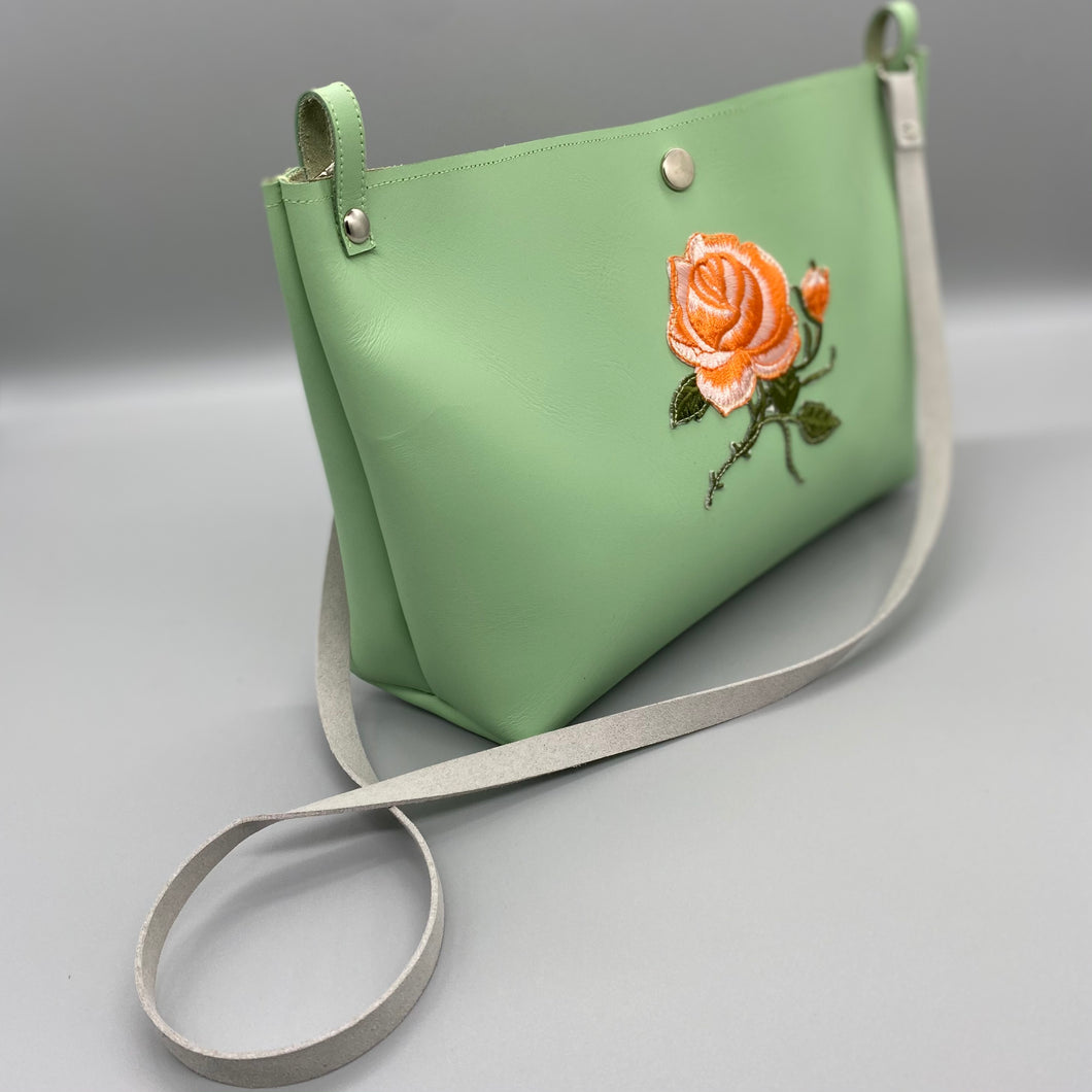 Pale green orange rose vegan leather bag