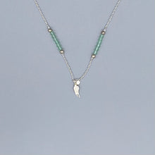 Load image into Gallery viewer, Pale green frosted bead and sterling silver angel wing necklace
